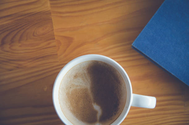istock coffee cup on brown wooden background (coffee, top) 901644166