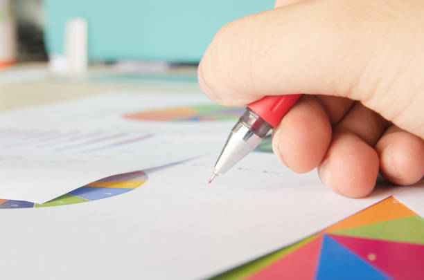istock Closeup of a businessman at work on some documents 901646828