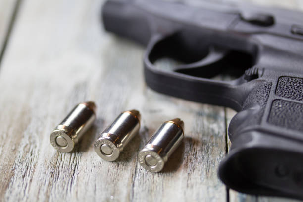 istock Pistol Handgun and Bullets 901653654