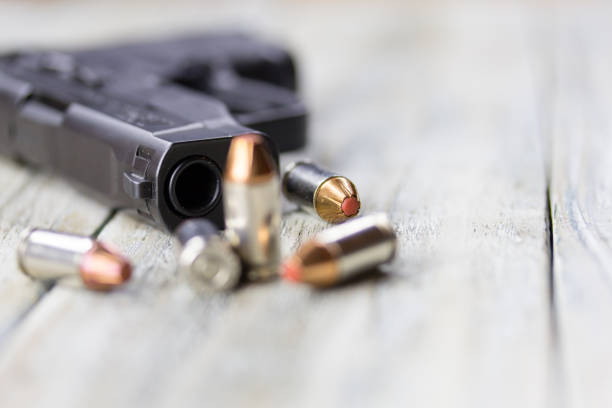 istock Pistol Handgun and Bullets 901654142