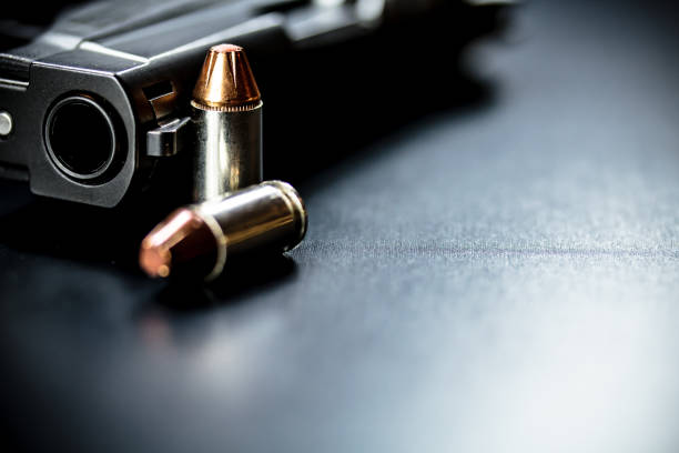 istock Pistol Handgun and Bullets 901654362