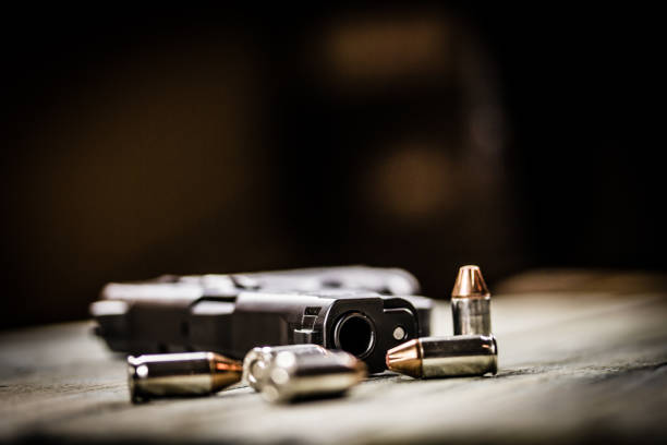 istock Pistol Handgun and Bullets 901654506