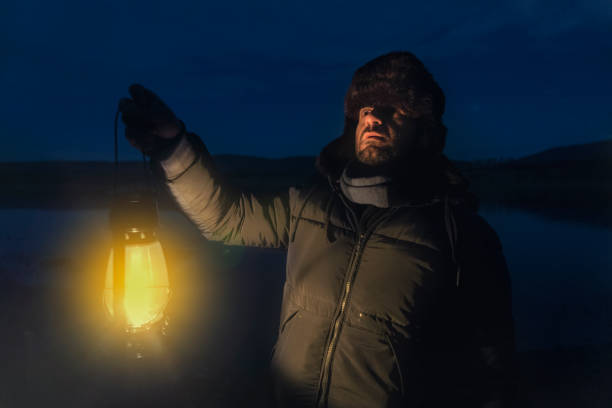 istock Oil Lamp Man in Night 901654548