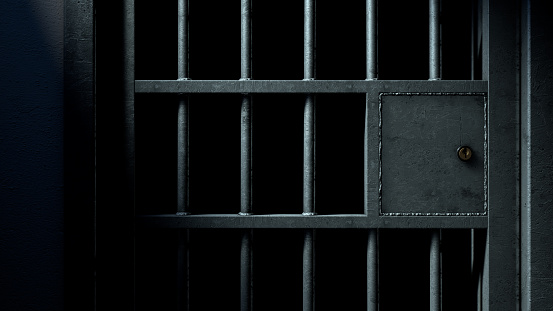 Puerta de la celda de cárcel y barras de hierro soldadas photo