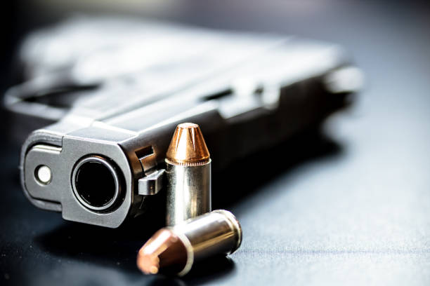 istock Pistol Handgun and Bullets 901657484