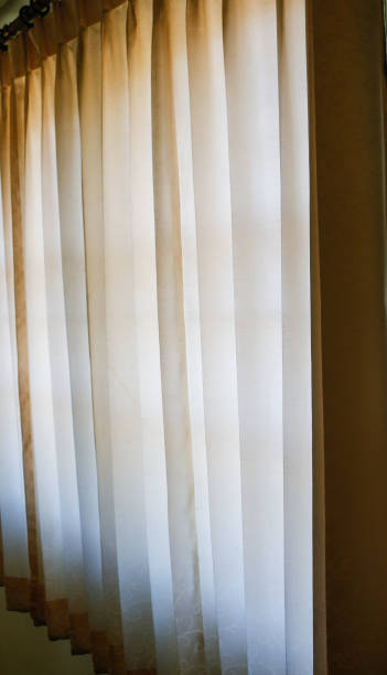 istock Room window with colorful striped curtains, close up 901658632