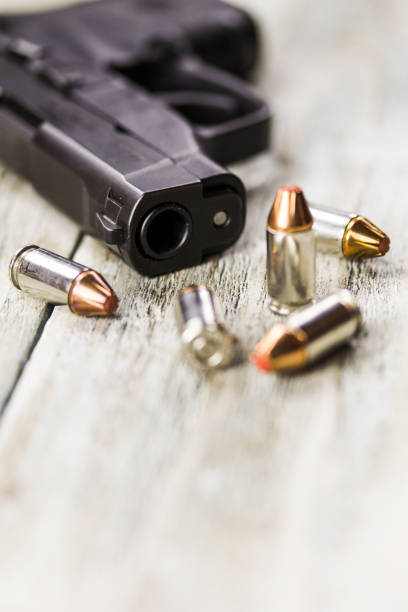 istock Pistol Handgun and Bullets 901658856