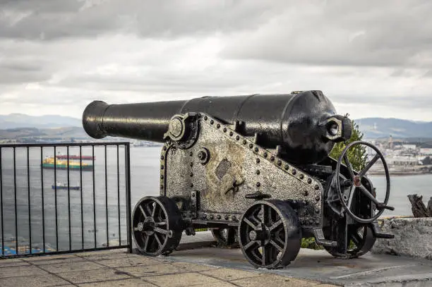 Photo of Old vintage cannon protecting sea bay on rock of Gibraltar