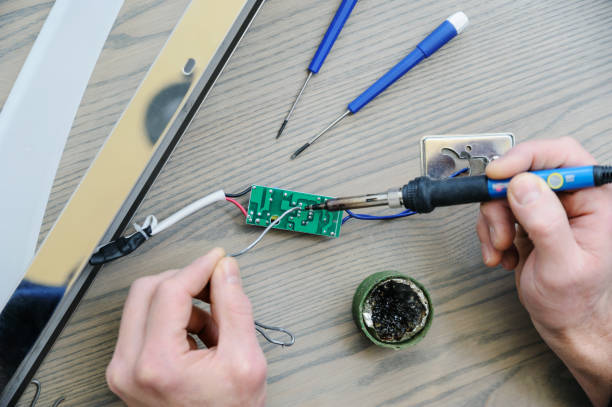 istock Repairing the power supply. 901662864