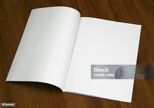 A Blank Magazine Opened On A Wooden Surface Stock Photo - Download Image Now - Magazine - Publication, Spreading, Template