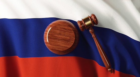 Wooden gavel on Russian flag.  Horizontal composition with copy space.