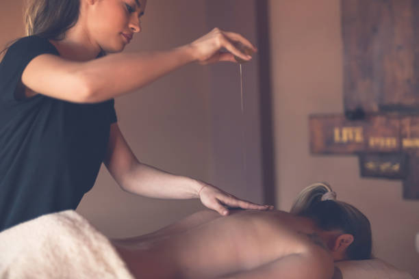 istock Woman pour massage oil 901665508