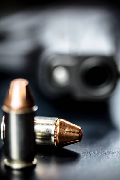 istock Pistol Handgun and Bullets 901665632