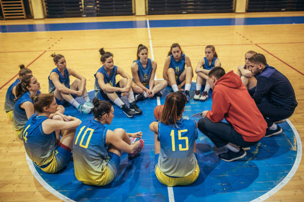 istock Coach talking to a young basketball players 901666686
