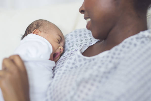 istock New Mom Holds Her Infant to Her Chest 901666752