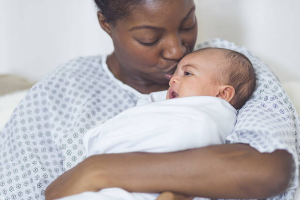istock New Mom Holds Her Infant to Her Chest 901666762