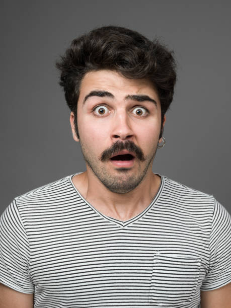 istock Mugshot Of Young Man Making A Face 901669336