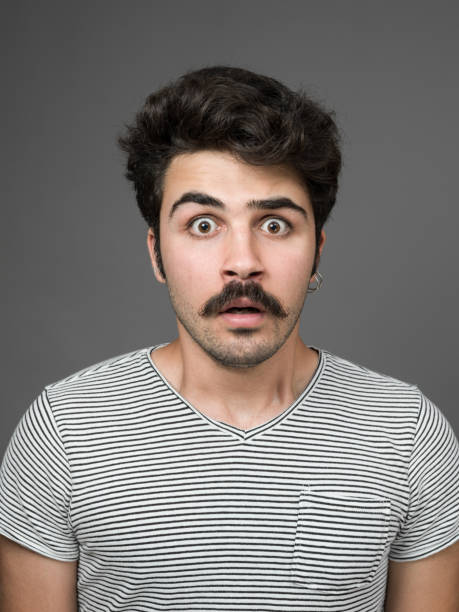 istock Mugshot Of Young Man Making A Face 901669494
