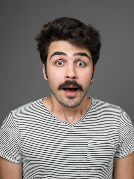 istock Mugshot Of Young Man Making A Face 901669674