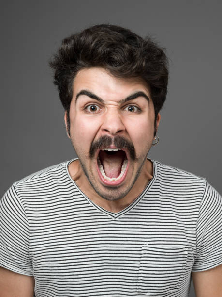 istock Mugshot Of Young Man Making A Face 901669950