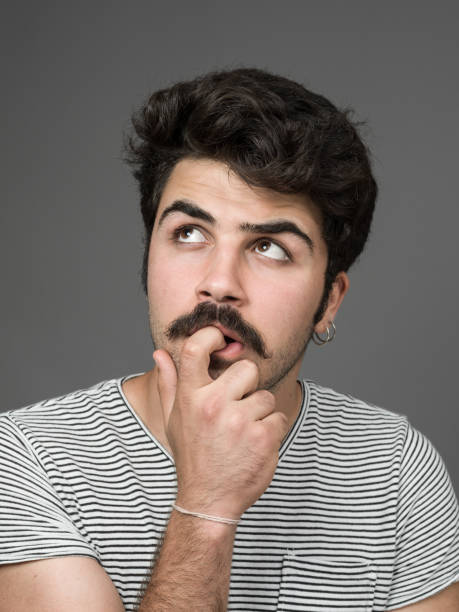 istock Mugshot Of Young Man Making A Face 901670086