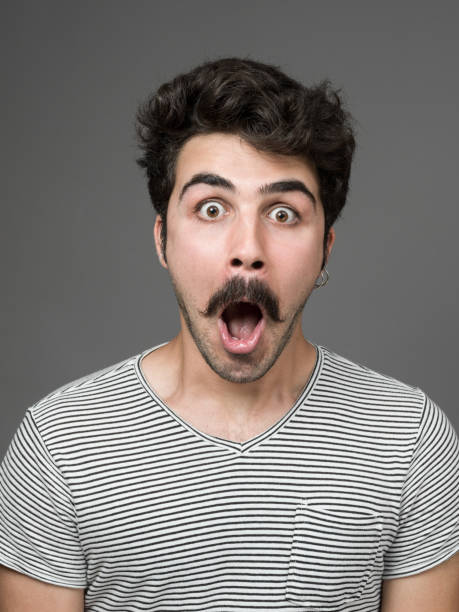 istock Mugshot Of Young Man Making A Face 901670200