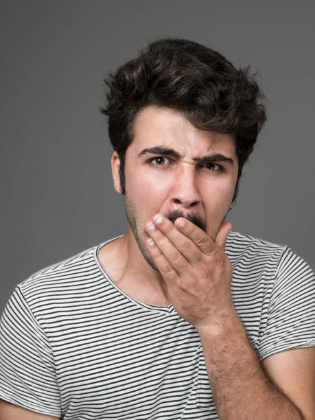 istock Mugshot Of Young Man Making A Face 901670248
