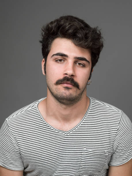 istock Mugshot Of Young Man Making A Face 901670270