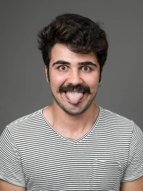 istock Mugshot Of Young Man Making A Face 901670684