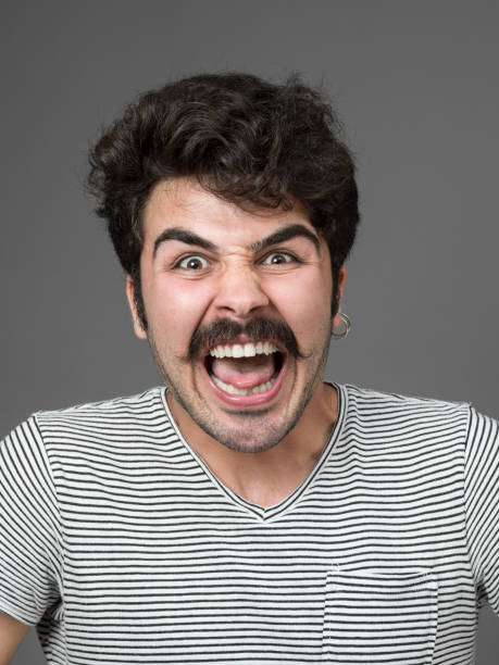 istock Mugshot Of Young Man Making A Face 901671110