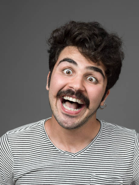istock Mugshot Of Young Man Making A Face 901671262