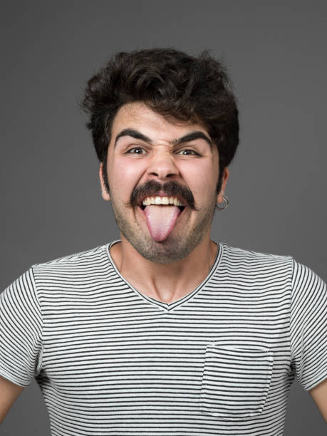 istock Mugshot Of Young Man Making A Face 901671762