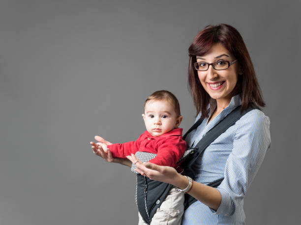 istock Young Mother Posing With Her Baby 901674424