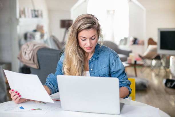 istock Young beautiful woman works on computer from a home with a laptop 901674538