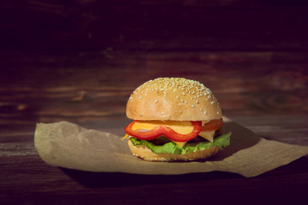 istock Delicious handmade burger on wooden background. Close view 901689066