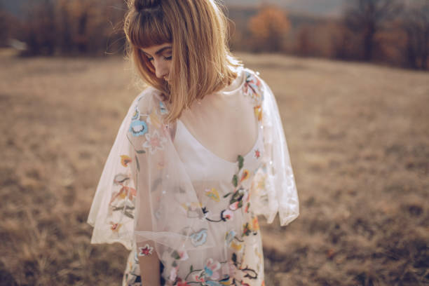 istock Hippie woman dancing in a meadow 901698798