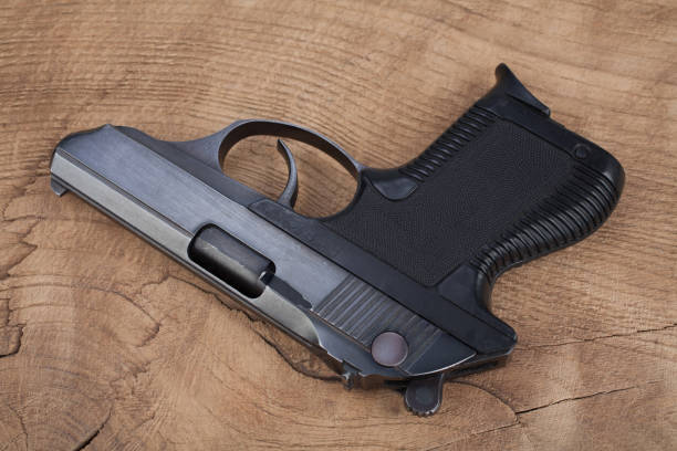 istock handgun on the wooden table 901709276