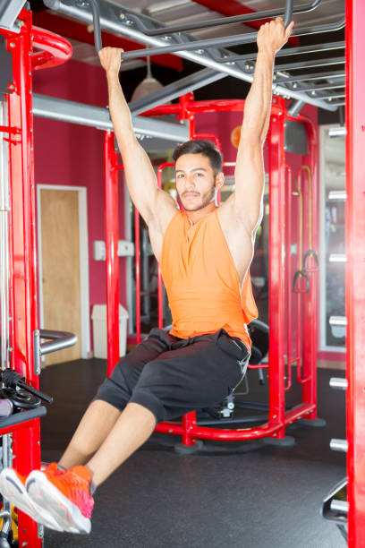 istock Sport Concepts Man Hanging at Pull Up Bar 901710674