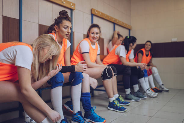 istock Volleyball team sitting in the locker room 901718680