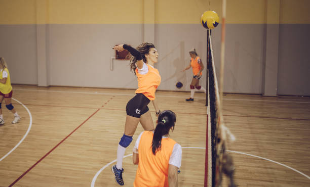 istock Girls Playing Volleyball 901718908