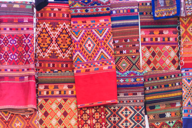istock Colorful of native thai style silk and textiles pattern. Beautiful handmade woven fabrics thai silk fabric textured, with different native style patterns. 901725438
