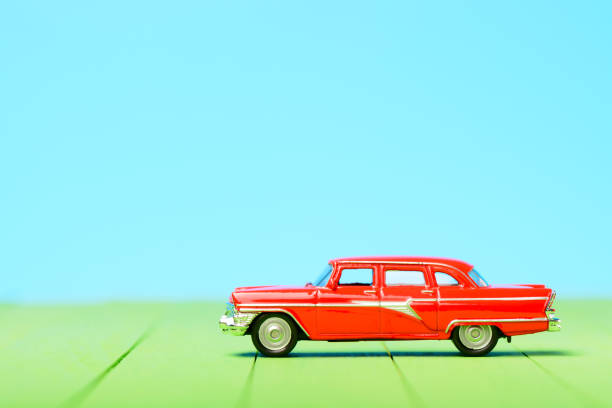 istock Red vintage car model on wooden boards 901725988