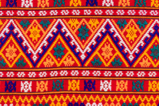 istock Colorful of native thai style silk and textiles pattern. Beautiful handmade woven fabrics thai silk fabric textured, with different native style patterns. 901733282