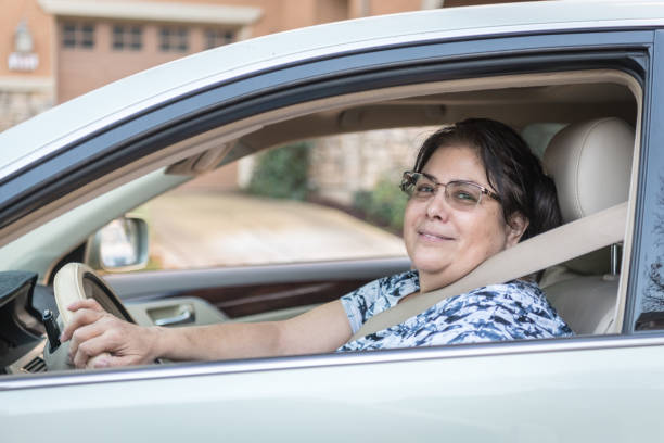 istock Driving mature woman 901739296