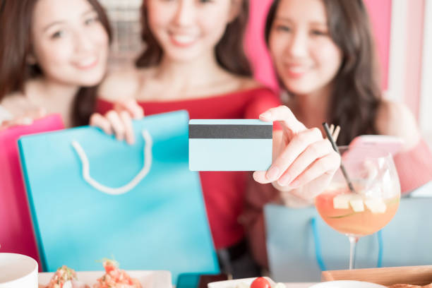 istock woman with credit card 901751700