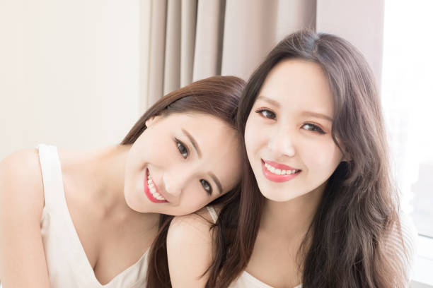 two beauty woman smile to you in the home