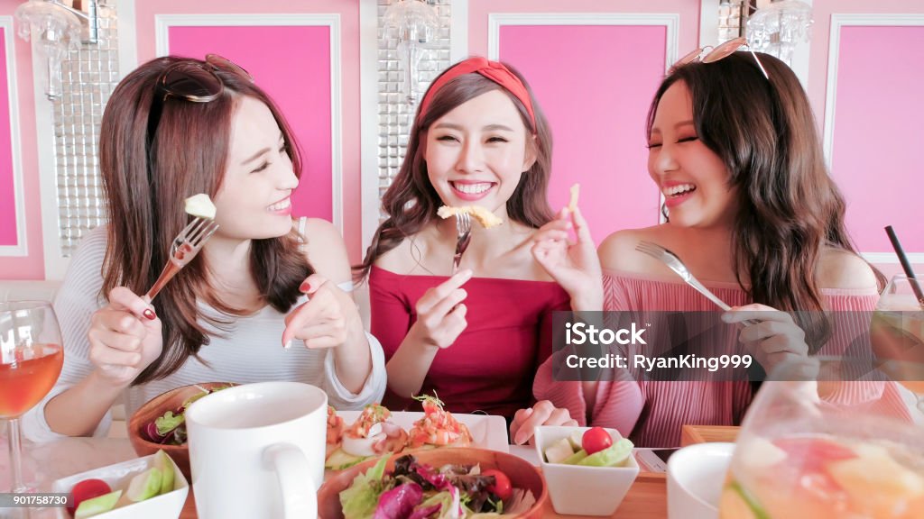 women chatting in restaurant happy women friends sitting and chatting in restaurant Asia Stock Photo