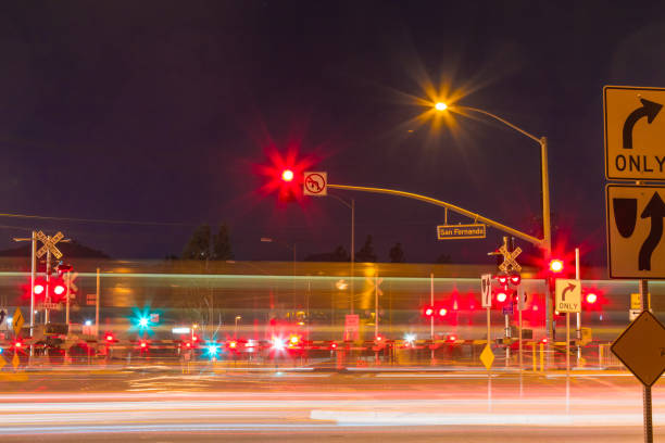 istock Railroad crossing during the night with motion gates 901762256
