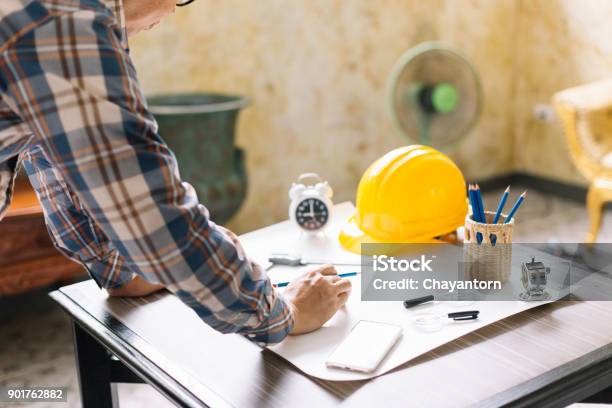 Architect Or Construction Engineer Sketching A Construction Project On Drawing Table With Engineering Tool In Office Construction Engineeringselective Focus Stock Photo - Download Image Now