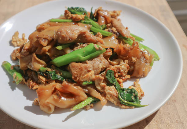 istock stir fried noodle with pork and kale 901765778